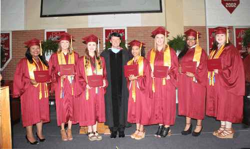 Pictured are the 2017 valedictorians and salutatorians with (center) Holmes President Dr. Jim Haffey. They are (left to right) Simone Lewis, valedictorian; Kelli Ray, salutatorian; Micah Redd, salutatorian; Ashley Hatch, valedictorian; Alexandra Katherine Perry, valedictorian; Addie M. Winters, valedictorian and Chelsea Miller, valedictorian.