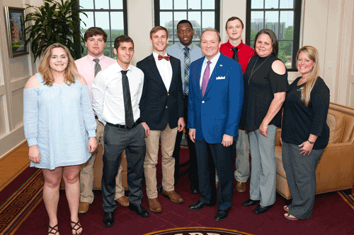 Pictured are (left to right) Holmes Community College students Kristin Boykin, Taylor Rigdon, Yoel Bacallao, T.C. Kenney, D'Morris, Mississippi University State President Dr. Mark E. Keenum, Adam Richardson, engineering technology instructor Lynn Boykin, and engineering technology instructor Heather Mooney in Dr. Keenum's office following the tour of MSU.