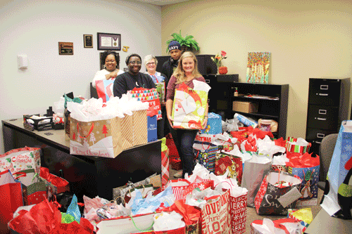 Representatives from the Holmes Ridgeland Campus delivered gifts collected by Rotoract. Pictured are (left to right) Financial Aid Advisor Mary Haralson, student Kazy Kyles, Assistant Librarian/Rotoract Adviser Jennifer Smith, student Taboris Roberson, and Head Librarian Blair Booker, with some of the gifts collected.