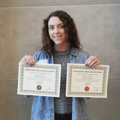 Regina Gray, a Ridgeland Campus Growl staff reporter, poses for a photo with her certificates following the Better Newspaper Contest Awards Presentation. Gray won a second place award for Best Sports Feature and a third place award for Best Sports News Story. The Growl won third for General Excellence.