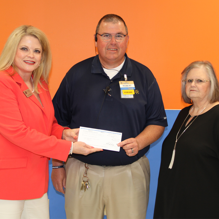 Foundation Executive Director Dr. Lindy McCain and Foundation Secretary Diane Harman accepted the check from Kosciusko Walmart Manager Robert Hawkins on May 1 in Kosciusko.