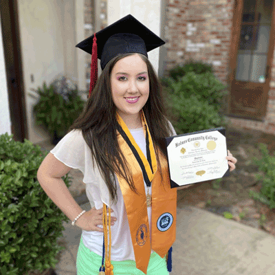 Pictured is Addison Stevens, a 2020 Holmes valedictorian and Hall of Fame inductee, who graduated from Holmes at the same time she graduated from high school.