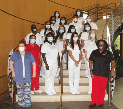 Pictured is the Holmes Ridgeland Campus Practical Nursing Class of 2020 with (front, left) instructor Heather Roberts and (front, right) instructor Dr. Lakesia Sutton. They are (second row, left to right) Asia Sandifer, Linda Knight-Naylor, Brittany Little, Katherine Filippou, (third row, left to right) Maxen Oethello, Erica Dotson, Karley Trim, Danielle Floyd, Carmen Harper, (fourth row, left to right) Morgan Allen, Jerissa O'Banner, Raven Carter, Diamond McCallum, (back row, left to right) Christina Rushing and Melissa Keese.