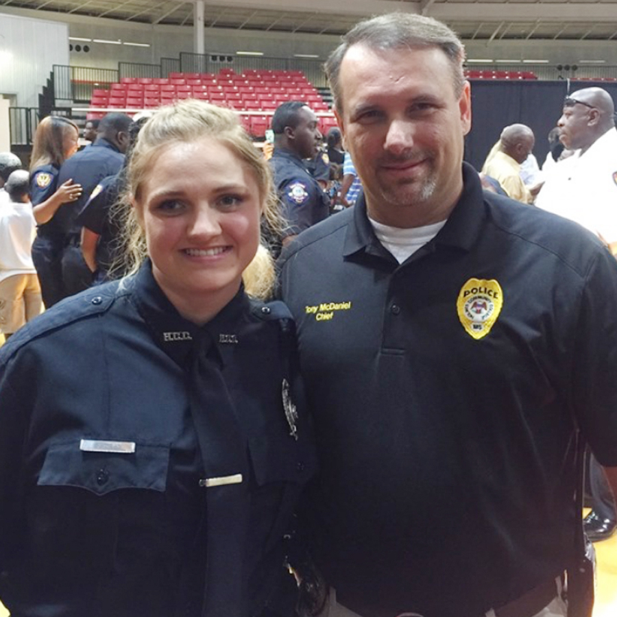 Holmes Patrol Officer Sheyanne Dean, left, is congratulated by Goodman Police Chief Tony McDaniel at her recent graduation from the Mississippi Delta Community College Law Enforcement Training Academy.
