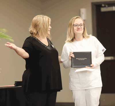 Pictured is Practical Nursing Department Chair Dr. Christi Blair with one of the 2020 graduates, Tiffany Sisney, during their Pinning Ceremony. The Attala Center PN Class of 2020 achieved an 100 percent pass rate on the NCLEX-PN this year.